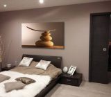 What table above a brown sofa?